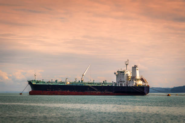 An empty tanker is in the bay at anchor.