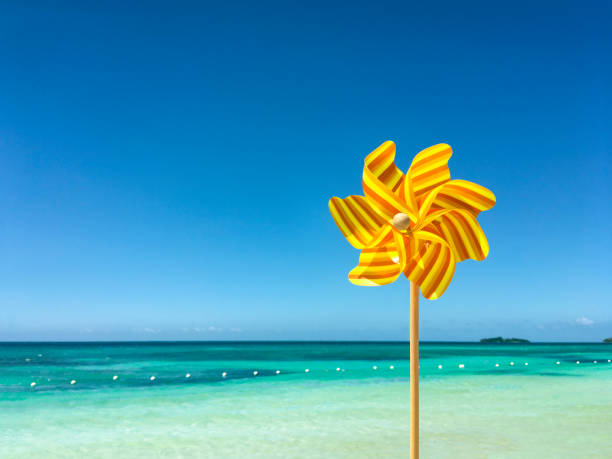 istock Pinwheel Toy On A Caribbean Sea Background 859223902