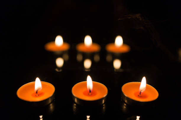 istock Many burning candles with shallow depth of field 859226980