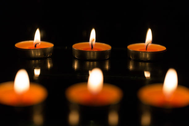 istock Many burning candles with shallow depth of field 859227156