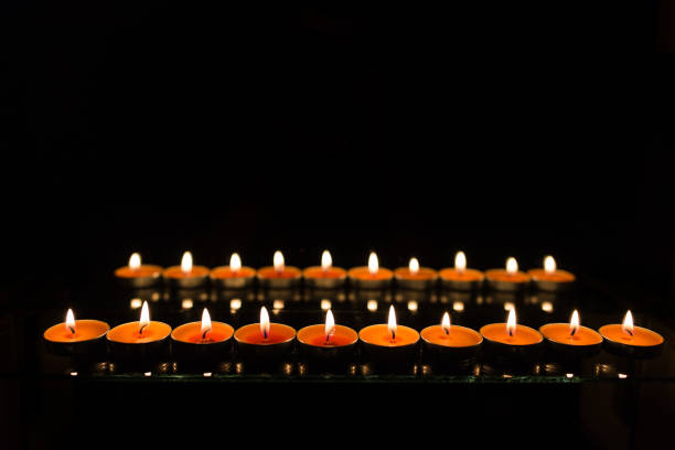 istock Many burning candles with shallow depth of field 859229254