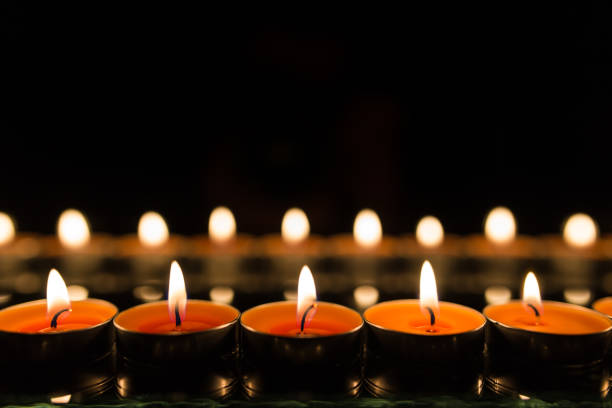 istock Many burning candles with shallow depth of field 859229320