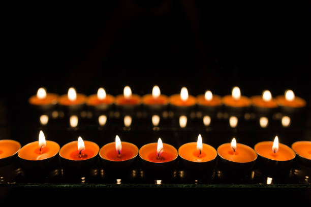 istock Many burning candles with shallow depth of field 859229332