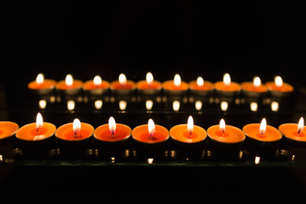 istock Many burning candles with shallow depth of field 859229400