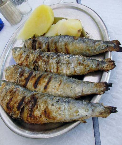 istock Grilled sardines with boiled potatoes 859229684