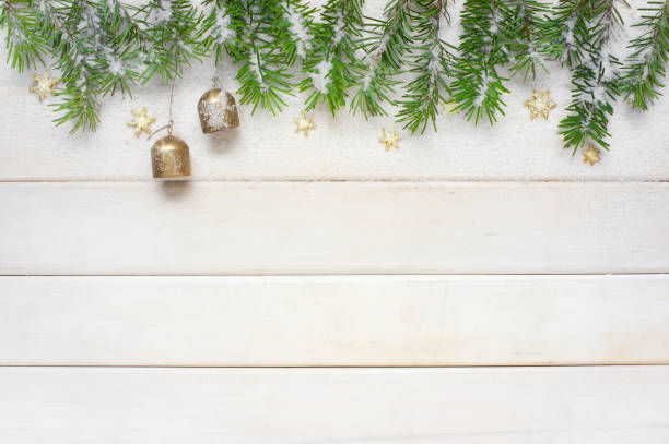 istock White Christmas background with spruse branches in the snow 859230334