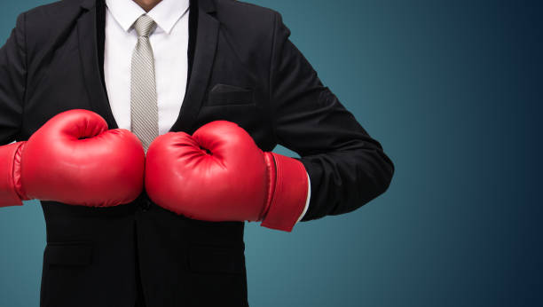 istock Businessman standing posture in boxing gloves 859236376
