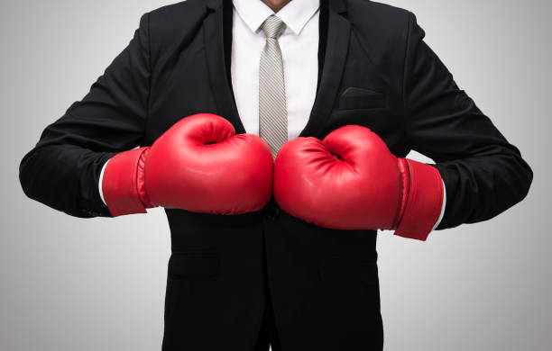 istock Businessman standing posture in boxing gloves 859236380
