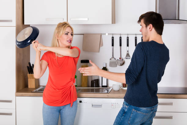 istock Wife Hitting With Pan To Husband 859236522