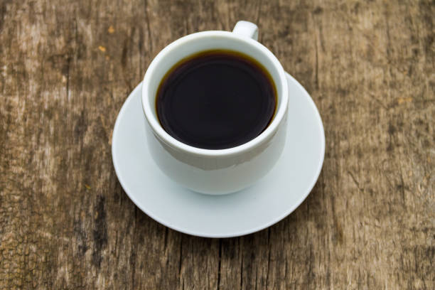 istock Cup of coffee on wooden table 859243972