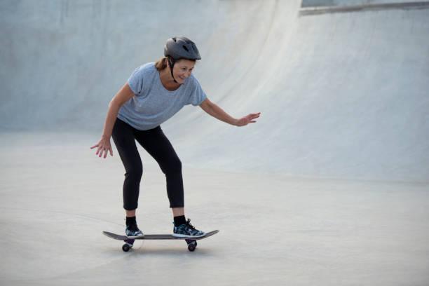 istock Sportive senior woman practicing skateboarding. 859250254
