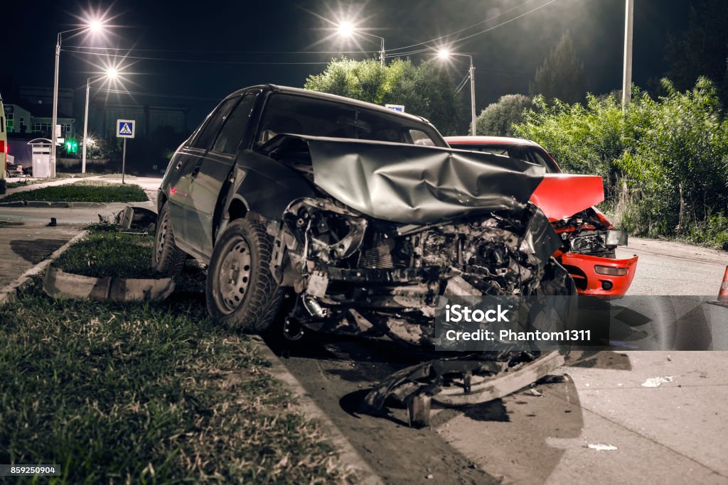 Night car accident Collision between two cars on the asphalt road Car Accident Stock Photo