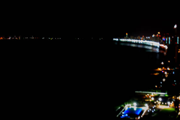 istock Beautiful soft bokeh panorama of night harbor view. 859255294