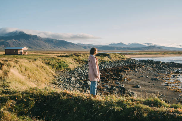 istock Woman walking on the beach in Iceland 859258608