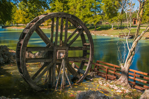 istock Wooden wheel of mill 859259380