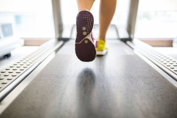 Asian sport woman running in fitness room.
