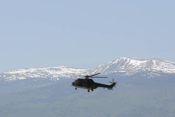 istock Military helicopter mountain 859262944