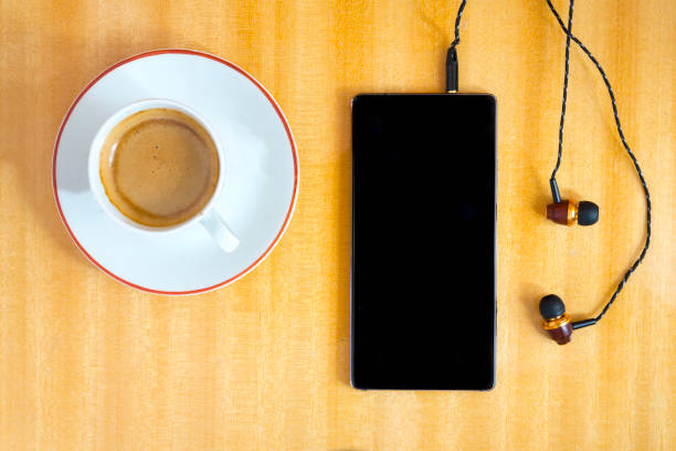 istock Smartphone with cup of coffee 859264872