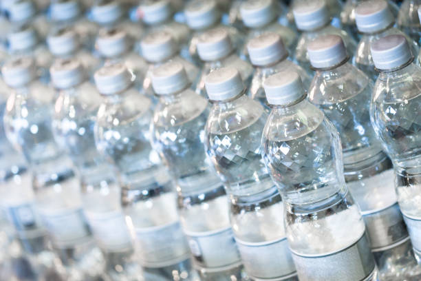 Pure bottled water in small handy bottles for sale on store shelves stock photo