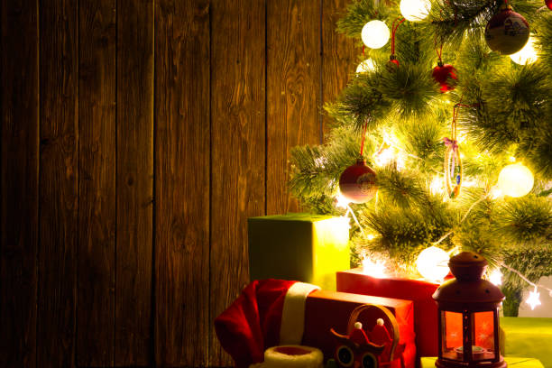 istock Background of xmas tree lights and wall with table 859269192