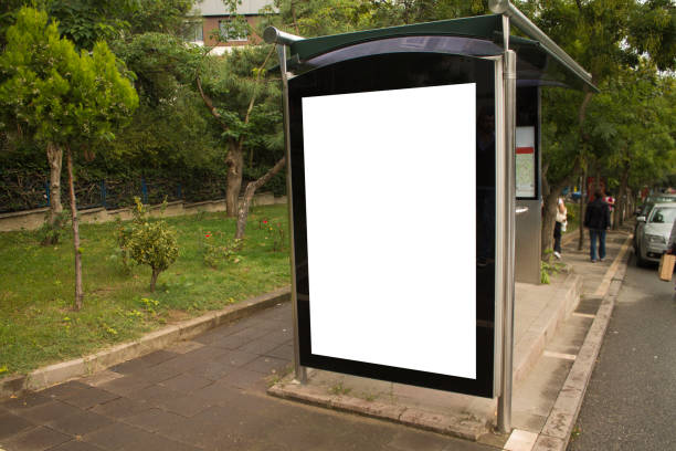 istock Photo empty lightbox on the bus stop. Vertical mockup, sunlight 859270870