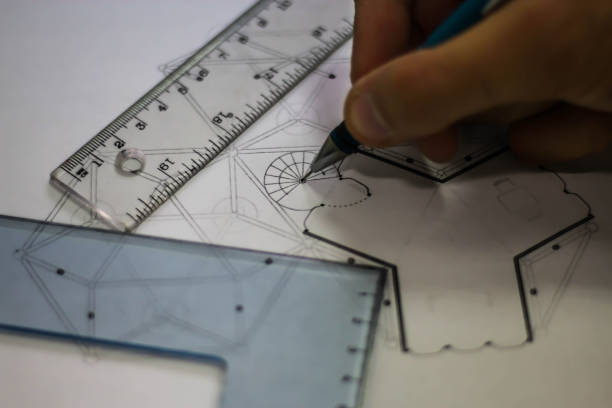 istock Architect draws for construction plans with pencil and rulers 859273364