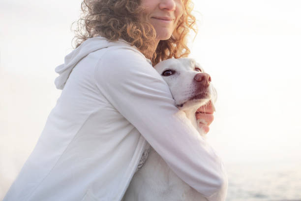 istock Protective woman embracing his dog while looking the view 859277148