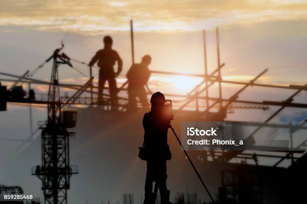 Silhouette Construction Site And Sunset Background Stock Photo - Download Image Now