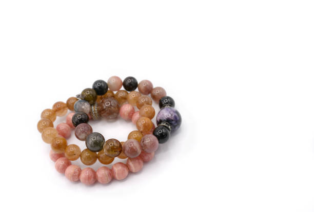istock 3 lucky stone bracelets on white background 859288624