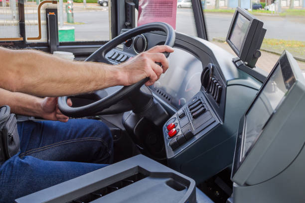 istock hands of driver in a modern bus by driving, europe 859288736