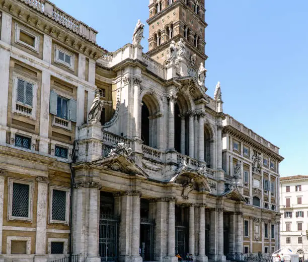 Side view Main facade of the Church called "Santa Maria della Neve" and also called "Basilica Papale di Santa Maria Maggiore" in Rome, Italy. With a clear blue sky