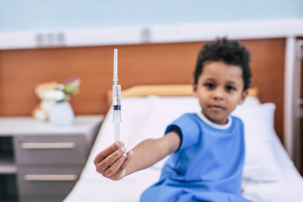 istock african american boy with syringe 859289112