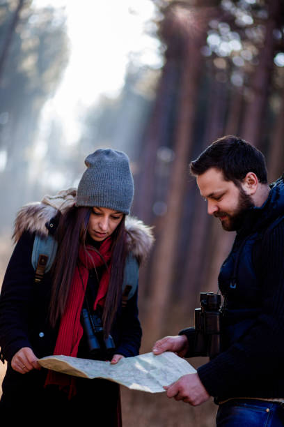 istock Couple Looking At Locator Map Together 859289416