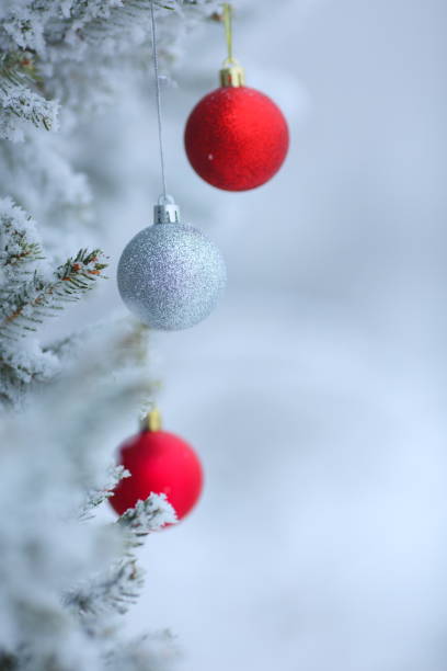 istock Christmas ornaments background with snow 859293090
