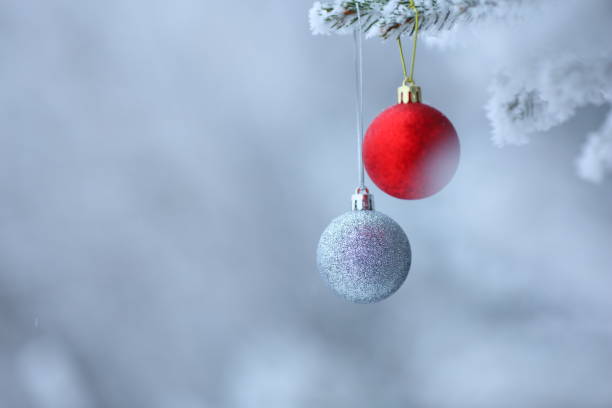 istock Christmas ornaments background with snow 859293398
