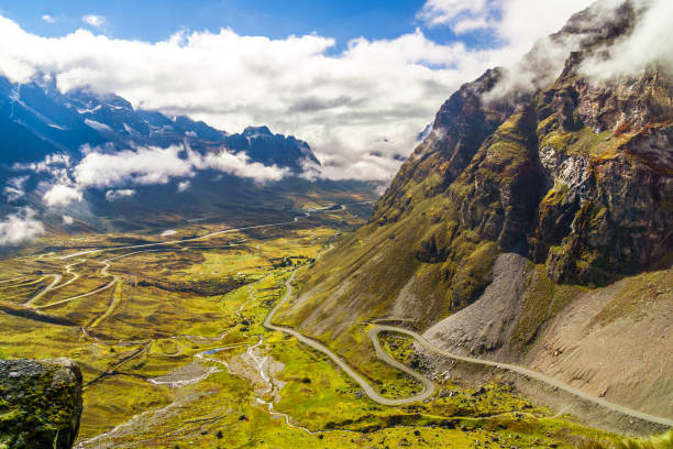 morning fog over the death road in the yungas of bolivia - wadi warning imagens e fotografias de stock