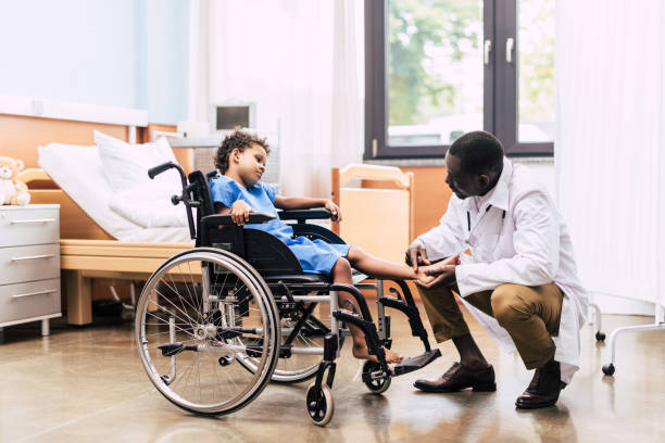 istock african american doctor and disabled patient 859294000