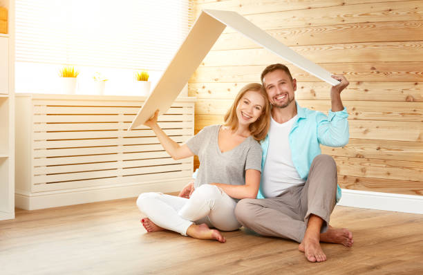 ept housing a young family. couple in  new home concept housing a young family. couple in a new home ept stock pictures, royalty-free photos & images