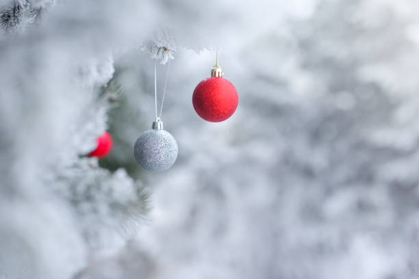 istock Christmas ornaments background with snow 859296320