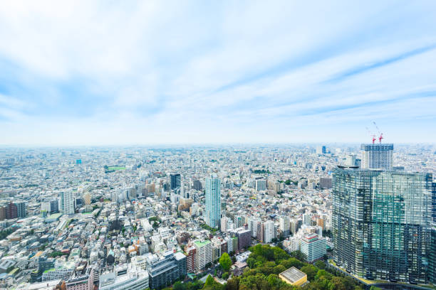 istock panoramic modern city skyline bird eye aerial view under dramatic sun and morning blue cloudy sky in Tokyo, Japan 859297100
