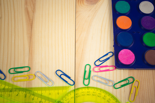 School supplies on wooden background. A place for your inscription.