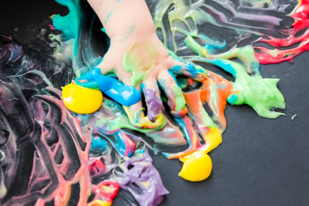 istock baby painting with his hands 859299312