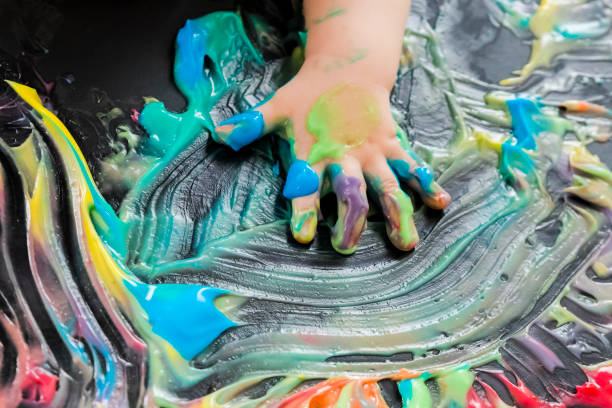 istock baby painting with his hands 859299674