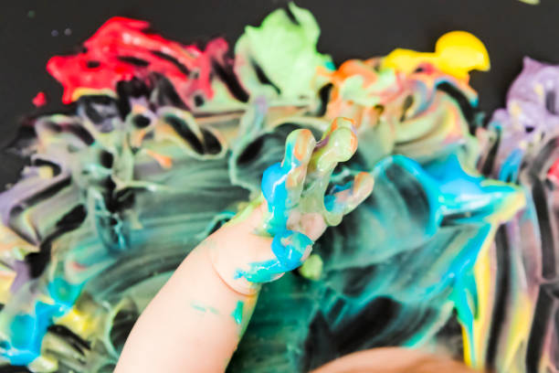 istock baby painting with his hands 859300056