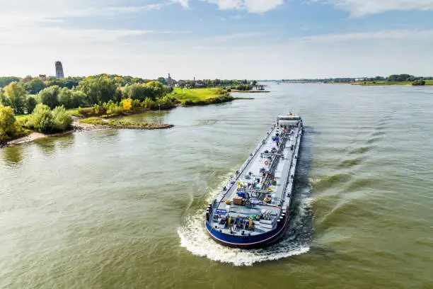 Large oil tanker passing Zaltbommel in the Netherlands