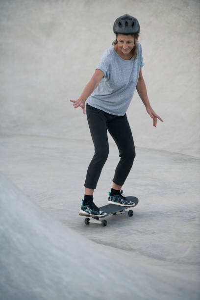istock Senior woman on skateboard. 859302504
