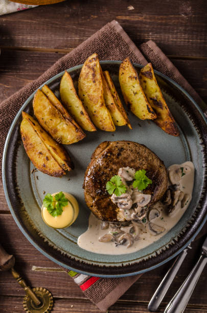 istock Steak with pepper sauce and mushrooms 859311256