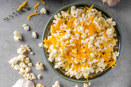 Homemade cheese popcorn with garlic, herbs and cheddar cheese