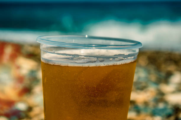 Travel Concept Tourism concept Travel Flyer Poster Greece Beach with beer glass cold beer in sand on beach