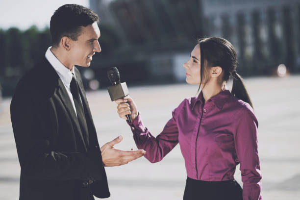 istock Business man giving an interview to a woman 859321420